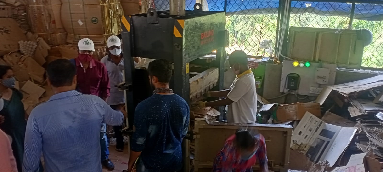 Scrap dealer explaining the process of recycling at Anarkali Basthi, Port Blair